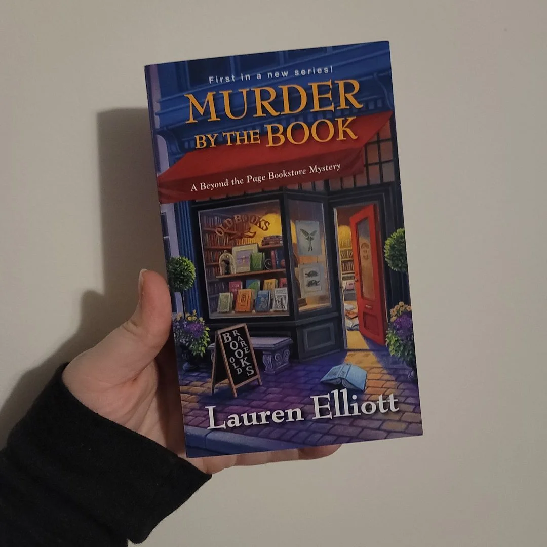 Murder by the Book by Lauren Elliott